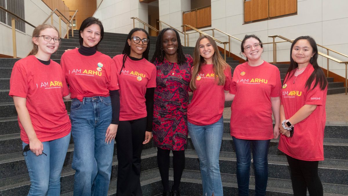 Dean Shonekan poses with ARHU students in The Clarice's Grand Pavilion.